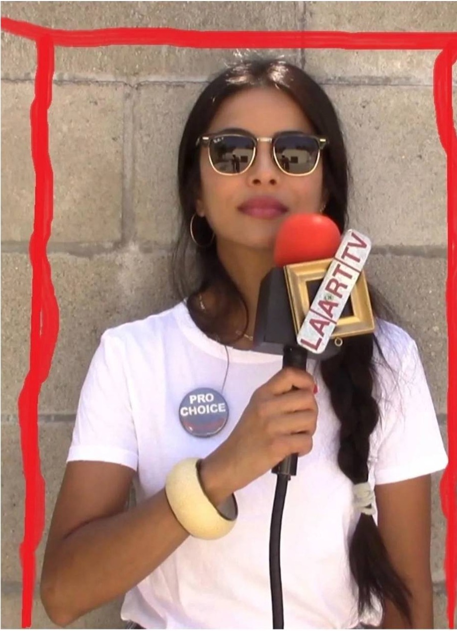 Pro-Choice Ray-Ban sunglasses interview photo with red hand-drawn frame